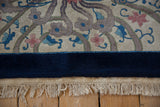 Plush cobalt blue border and original ivory fringe on a hand-knotted Chinese Art Deco rug.