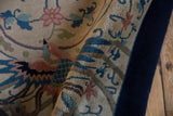 Evenly clipped hand-knotted pile and solid cobalt blue border of a vintage Art Deco rug.