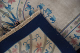 Intact cobalt blue side cord selvage and ivory fringe on a vintage Chinese hand-knotted rug.