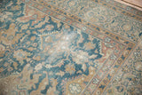 Distressed Agra carpet section showing dusty ocean blue palmettes and worn, soft patina.