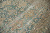 Distressed vintage Agra carpet texture, showing foundation, dusty blue, and antique ivory florals.