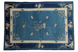 Antique Chinese Peking carpet with open field, central tree, hut, floral motifs in cobalt and ivory.