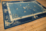 Antique Peking carpet detail: blossomed tree, bird motif in cobalt, sky blue, antique ivory.