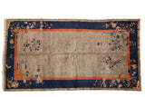 Antique Chinese Art Deco Fetti-Li style rug with silver field, cobalt blue border, and delicate floral bird motifs.
