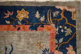 Hand-knotted Art Deco Chinese rug pattern in cobalt blue, terra cotta, and golden hues.