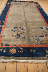 Antique Art Deco rug border with cobalt blue, deep coral stripe, and gold floral motifs.