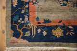 Antique Chinese Art Deco rug corner with Fetti-Li bird, coral border, and ivory fringe.