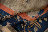 Textured pile of antique Chinese Art Deco carpet with coral, cobalt, and golden Fetti-Li motifs.