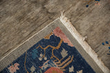 Hand-knotted foundation weave, original grey selvage, and tattered cream fringe on the antique rug.