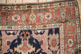 Expressive arabesque corner with floral motifs in deep terra cotta, jade, and dusty rose.
