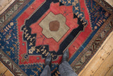 Fine weave antique Malayer rug with serrated inner border and primitive cherry red, navy, beige motifs.