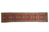 Vintage Persian Heriz runner, cherry red field with germinating plant tree of life motif, blue and gold borders, 2' x 9'.