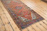 Vivid blues of stepped spandrel and border against brick red field of vintage Heriz rug.