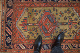 Even wear on the serrated medallion and gold ochre field of a collector Heriz rug.