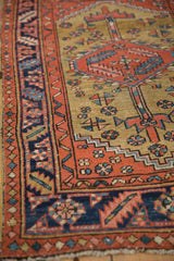 Even wear across the knot heads and intricate borders of a collector-grade antique Persian Heriz rug.