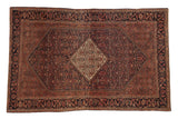 Antique Farahan Sarouk rug, diamond medallion, henna plant motif, Herati border, in navy, cochineal red, ivory.