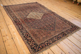 Antique Farahan Sarouk border showcasing Herati design in navy, pale red, and teal tones.