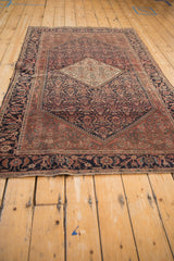 Antique Farahan Sarouk rug's border detail, featuring Herati motif and henna plant field. Navy, red, ivory.