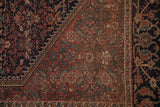 Antique Farahan Sarouk rug corner, dusty pale cochineal red henna plants, navy Herati border.