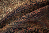 Close-up of the antique Farahan Sarouk rug's Herati border and henna plant field design.