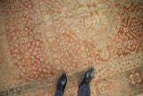 Even wear to the knot heads on a distressed Malayer carpet with terracotta and sky blue pattern.