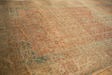 Evenly worn low pile showing terracotta and dusty blue trellis designs on a vintage Malayer carpet.