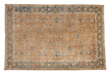 Antique Persian Khoy carpet with a Safavid-inspired floral design on a gold wash field with dusty blue accents.