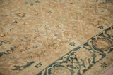 Evenly worn texture showing the knot heads and low pile of an antique gold wash Persian carpet.