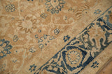 Even wear showing the knot heads and dusty blue florals on an antique Persian Khoy carpet.