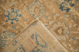 Antique Khoy carpet corner folded to reveal the hand-knotted foundation and low pile texture.
