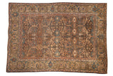 Distressed vintage Mahal carpet with a lattice of floral palmettes in chocolate brown, dusty blue, and beige.
