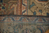 Intact chocolate brown selvedge separates the pile from the rug's hand-knotted back.