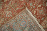 Distressed texture and hand-knotted foundation on the folded corner of a vintage Mahal carpet.