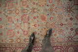 Antique Yezd carpet's distressed pile with Safavid palmette design in dusty blue and magenta.