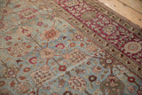 Worn pile of antique Yezd carpet, Safavid palmettes in dusty blue, madder, ivory.