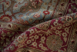 Distressed antique Yezd rug, Safavid palmette and vine motifs in burgundy and dusty blue.