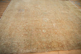 Faded gold wash Tabriz rug detail: floral palmettes, scrolling leaves, even wear.