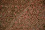 Evenly worn wool pile showing knot heads in dusty blush and chocolate brown.