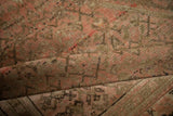 Detailed view of the distressed Malayer rug's texture with heavy, even abrashes.
