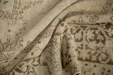 Distressed Kerman carpet with soft wool pile, ivory, brown, subtle blue floral vines.