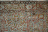Low pile and faded Gol Ferang pattern detail on this distressed vintage Sarouk rug.