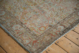 Distressed Sarouk rug border with Gol Ferang scrolled floral motifs in soft blue and rose.