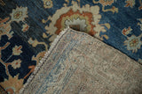 Woven foundation and low pile showing visible knot heads on a distressed Hamadan rug.