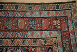 Exquisite detail of antique Malayer borders with color abrashes in the powder and navy blue wool.