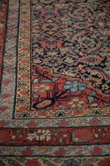 Close view of the hand-knotted pile on an antique Malayer carpet with a detailed Herati design.