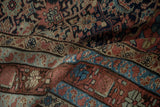 The supple hand and detailed Herati weave of an antique Malayer carpet in rich, time-softened tones.