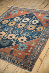 Detailed view of hand-knotted Persian Mehriban pile, navy blue palmettes, and rust border.