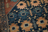 Detail of vintage Mehriban rug showing unusual navy, madder root, teal palmette pattern.