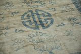 Soft low pile and visible knot heads on a distressed Peking carpet with a blue medallion.
