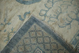 Reverse view of the quatrefoil trellis border and woven foundation of an antique Peking carpet.
